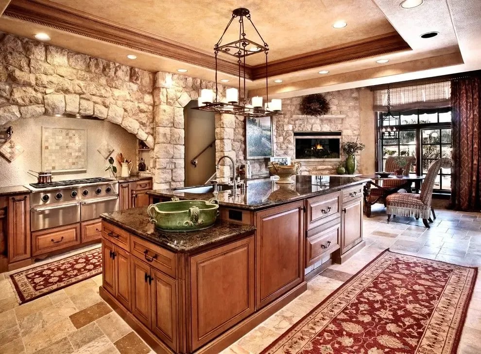 Antique Biblical Limestone, Tuscan style luxury kitchen featuring rough-cut stone accent walls and limestone tile flooring