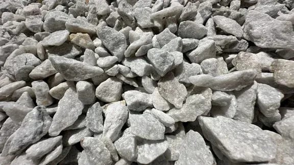 Crushed white marble aggregate stones for landscaping and construction material supply