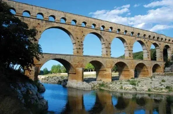Encyclopedia Britannica, Ancient Roman Pont du Gard limestone aqueduct bridge crossing over a river